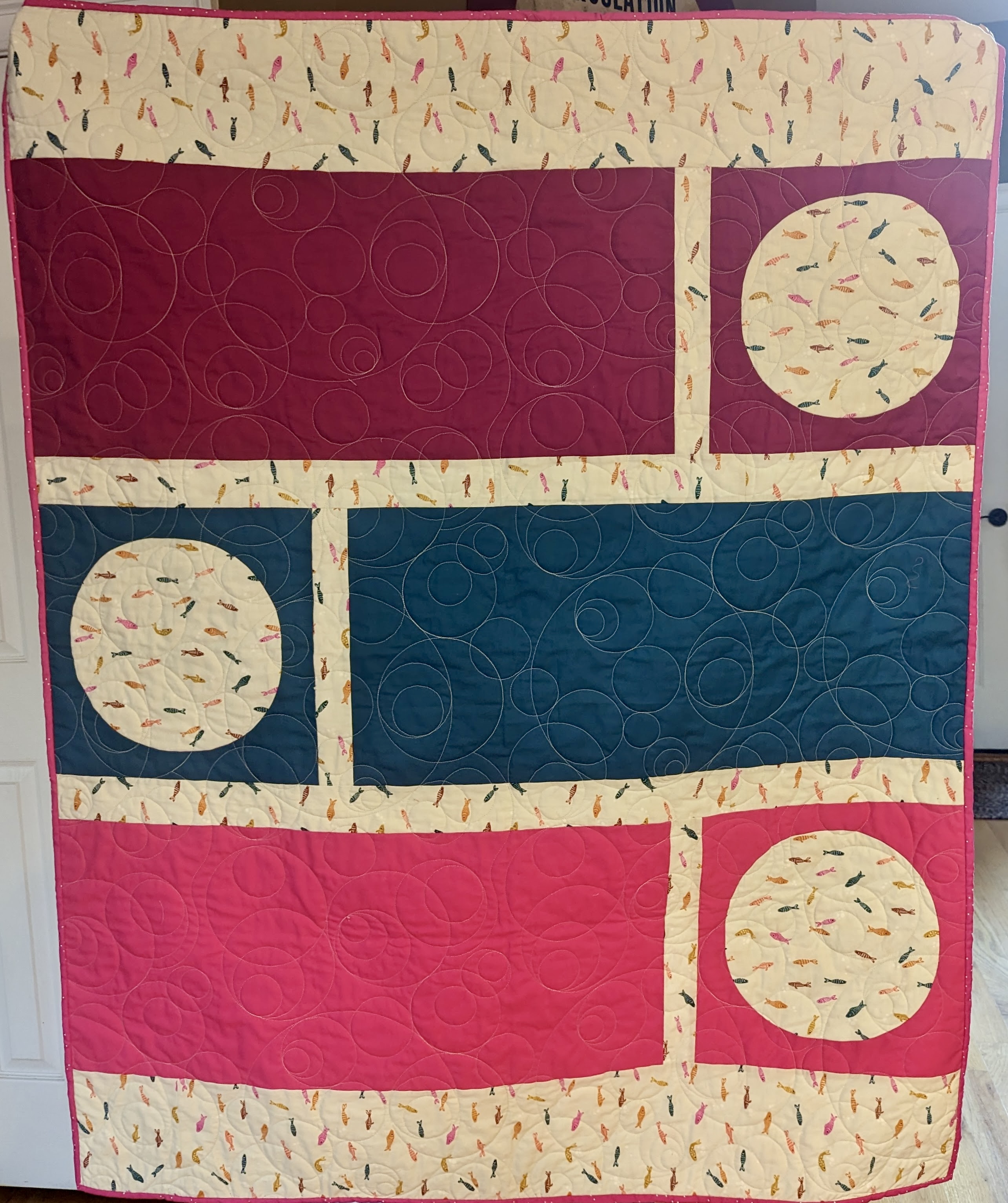 quilt featuring circles and rectangles